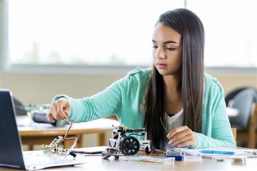 Student creating robots
